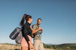 © Studio Firma/Stocksy - Man and Woman Hiking in Mountains