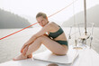 © Julia Volk/Stocksy - Blonde Woman On Sailing Boat