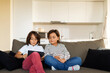© Valentina Barreto/Stocksy - kids watching videos on a tablet at home