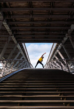 Person Performing Stretching Exercise On The Bridge
