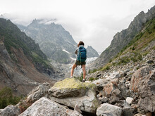 Young Woman Hiking Alone In Remote Mountain Area