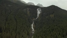 Flowing Stream On Rainforest Mountains At Odegaard Falls Near Bella Coola, British Columbia, Canada. Aerial 