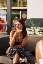 Stylish Woman With Cocktail In Restaurant