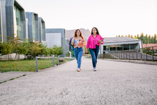 Smiling Students Walking In Campus