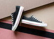 © Nadine Greeff/Stocksy - Black lace up sneaker shoes