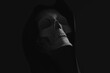 © Marcos Osorio/Stocksy - Skull with hood for Halloween