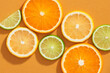 Different citrus fruits with leaves as background