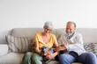 © Studio Firma/Stocksy - Senior Couple Relaxing at Home