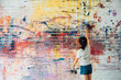 Asian girl painting on the wall