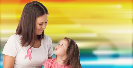 Wall Mural - Beautiful loving mother and daughter, hugging each other, symbol of World Breast Cancer