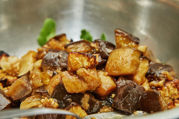 Poster - Baked, diced eggplant in bowl of arugula. Step by step recipe