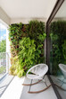 © Koen Van Damme/Stocksy - lounge chair on balcony