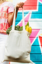 Woman With Tote Bag Of Fresh Produce