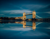Fototapeta Londyn - Tower Bridge London United Kingdom with water reflecting 
on Thames river