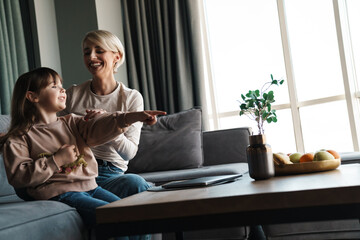 Canvas Print - Happy young mother and her little daughter bonding