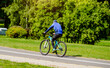© licvin - Cyclist ride on the bike path in the city Park