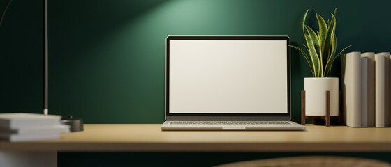 Canvas Print - modern home workspace at night with laptop screen mockup and decor on wooden table over green wall.