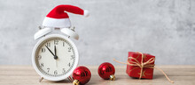 Merry Christmas With Vintage Alarm Clock And Xmas Decoration On Wooden Table. Party, Holiday And Boxing Day Concept