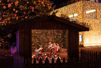 Nativity scene with christmas crib showing the holy family at traditional Christkindlmarkt near Hotel Terme, Meran(o) South Tyrol Italy