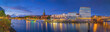 Panorama view of  harbour along the Schlachte Embankment and  Martinianleger by Bremen. View of Bremen riverside, Weser river, Schlachte promenade by evening. Skyline from Bremen with St. Martini.