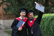 © Тарас Нагирняк - Two happy graduate male friends celebration their graduation with crazy emotions and diploma in hands
