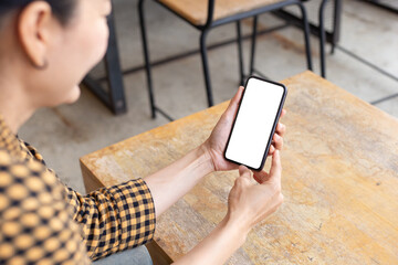 Canvas Print - cell phone blank white screen mockup.hand holding texting using mobile on desk at office.background empty space for advertise.work people contact marketing business,technology