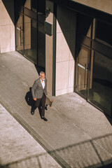 Wall Mural - Top view of an offcie district and one man walking