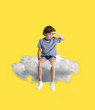 © master1305 - Creative collage with little preschool boy sitting on white cloud and flying at sky. Concept of childhood, dreams, fantasy