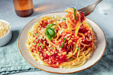 Spaghetti With Tomato Sauce, Cheese And Basil, Fork Lifted Over Plate