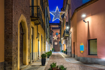 Wall Mural - Old city street and Christmas illumination in Alba, Italy.