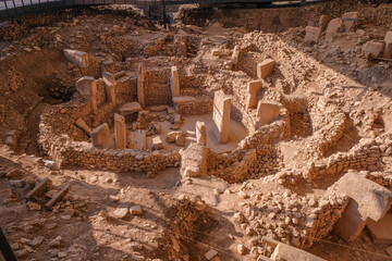 Wall Mural - Gobeklitepe ruins view in Sanliurfa Province of Turkey. Gobeklitepe, whose construction dates back to 10000 B.C., is known as the oldest and largest center of worship in history.