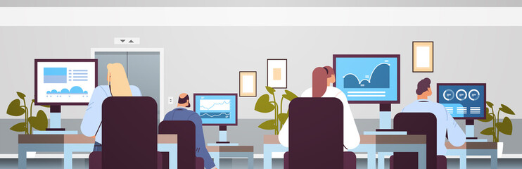 Canvas Print - mix race traders stock market brokers analyzing charts or making presentation on computer monitors at workplace