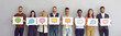 © Studio Romantic - Different multiracial multiethnic people holding various cards and sheets of paper with pictures of colorful mockup chat message bubble icons. Concept of communication via messengers and social media