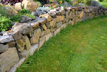 The Dry Wall Serves As A Terrace Terrace For The Garden, Where It Holds A Mass Of Soil. The Wall Is Slightly Curved, Which Helps It To Stabilize Better. Planting Perennials And Rock Gardens