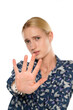 Young blond woman making stop hand sign