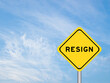 © bankrx - Yellow transportation sign with word resign on blue sky background
