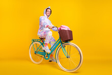 Full Length Body Size Photo Woman In Unicorn Costume Smiling Riding Bicycle Isolated Bright Yellow Color Background
