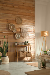 Wall Mural - Stylish living room interior with wooden furniture and beautiful houseplants