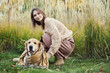 © snedorez - Beautiful girl with two golden retrievers in park