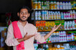© PRASANNAPIX - Indian farmer standing at fertilizer shop