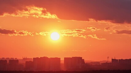 Wall Mural - The haze over the houses in the city during the heat, the time-lapse of the setting sunset sun