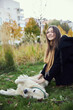 © snedorez - Beautiful girl with golden retriever in park