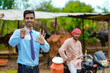 © PRASANNAPIX - Young indian agronomist or animal doctor collecting milk sample at dairy farm