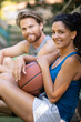 © auremar - couple relaxing after playing basketball