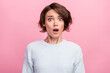 Photo of amazed shocked young woman afraid scared problem bad mood astonished isolated on pink color background