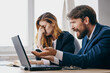 © SHOTPRIME STUDIO - managers sitting in front of a laptop teamwork technologies
