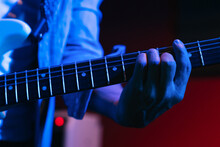 Anonymous Crop Musician Playing Guitar In Club