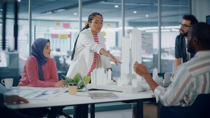 Modern Multi-Ethnic Architectural Agency Office Meeting. Group of Professional Architects, Designers, Developers, Investors use Building Model to Design Sustainable, Contemporary Housing Project