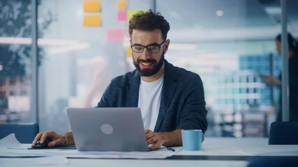 Poster - Modern Office: Portrait of Young Stylish Businessman Wearing Glasses Works on Laptop, Does Data Analysis, Website Design, Creative Developemnt. Digital Entrepreneur Works on e-Commerce Startup Project