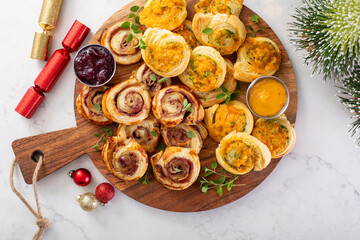 Christmas appetizers, puff pastry wheels filled with cheese and jam